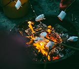 Marshmallows roasting over a fire pit